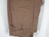 a close up of a pair of brown pants on a white surface
