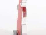 a glass sculpture of a building on a black base