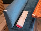 a blue couch and a table in a room