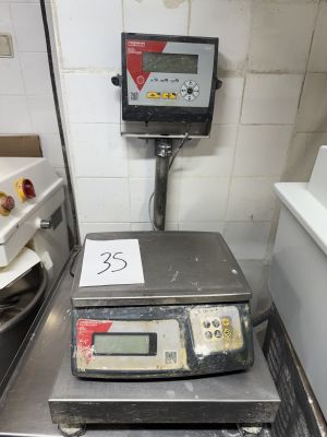 une image représentant une balance de cuisine sur laquelle figure un chiffre