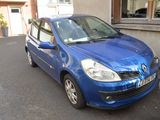 a blue car parked on the side of the street