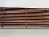 an image of a wooden slatt sitting on top of a white floor