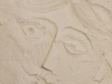 a close up of a clay sculpture of a woman ' s face