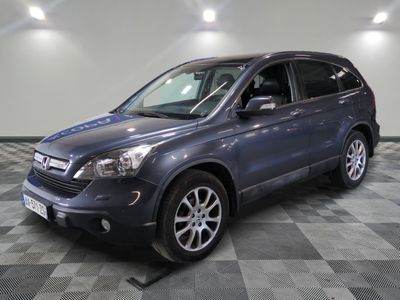 a picture of a blue suv parked in a garage