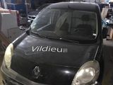 a black car that is parked in a garage