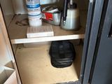 a small cabinet with a lot of stuff in it