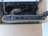 a box with a laptop and a charger inside of it