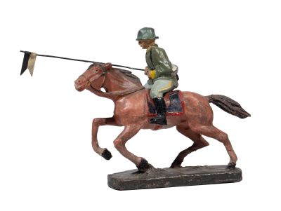 figurine of a man riding a horse with a flag on its back