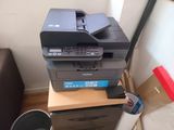 a printer that is sitting on top of a desk