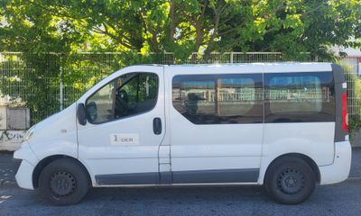 a white van that is parked in the parking lot