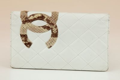 wallet with a snake embellishment on the front of the wallet