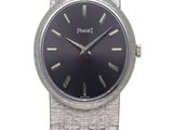 an image of a silver wrist watch with a black face