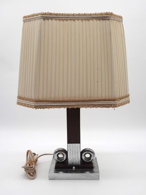 a lamp that is sitting on a table next to a cord