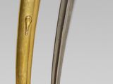 two different types of knifes on a gray background