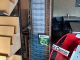 a shelf with a lot of boxes on it in a room