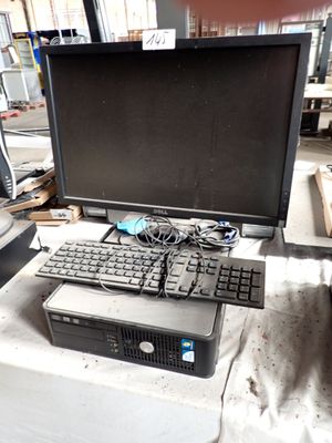 a computer sitting on top of a table with a keyboard and mouse
