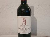 a bottle of wine that is sitting on a table