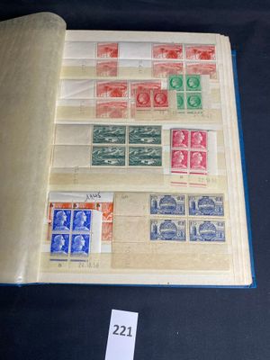 an open book with stamps on it on a table