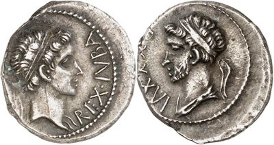 a silver coin with an image of a woman on it