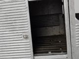 a metal door that is open on the side of a train
