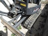 a small machine that is sitting in the dirt