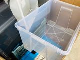 a box full of assorted items sitting on the floor