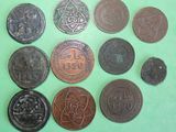 several different types of coins on a green surface