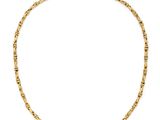 un collier à chaîne en or orné de petites perles sur fond blanc