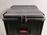 a black case that is sitting on a white surface