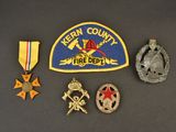 several badges and medals are displayed on a table