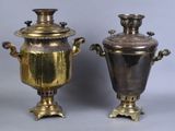 pair of antique brass urns with handles on pedestals