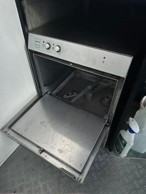 an oven with a door open in a kitchen