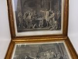 deux tableaux encadrés représentant un homme et une femme dans une cuisine