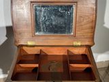 a wooden box with a mirror on top of it