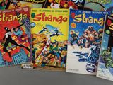 a lot of comic books sitting on a table