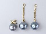 three pairs of grey pearls and a gold chain on a white background