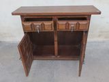 a wooden cabinet with two drawers and a door open