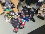 a pile of clothing and other items on the floor