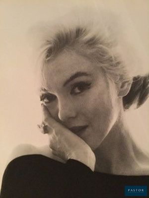 an old black and white photo of a woman with her hand on her face