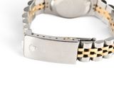 an image of a close up of a watch on a white surface