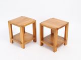 pair of small wooden side tables on a white background