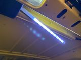 a close up of a car ' s tail light with blue lights