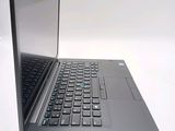 a laptop computer sitting on top of a white table