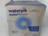 the box of waterpik water flosser is sitting on the table