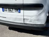 a white van parked on the side of the road