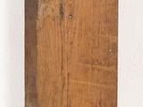 a picture of a piece of wood on a white surface