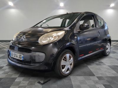 a picture of a small black car on a checkered floor