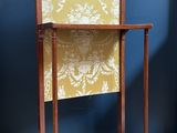 an image of a wooden table with a yellow and white cloth on it