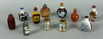 a lot of glass bottles that are sitting on a table