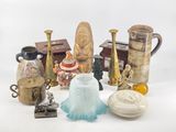 many different vases and other decorative items on the table
